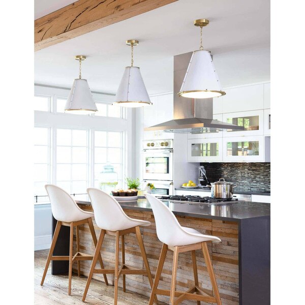 Kitchen island with French chandeliers and white chairs